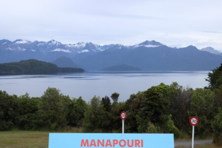 Lake in Manapouri with the mountains of the Fjordlands in the background.