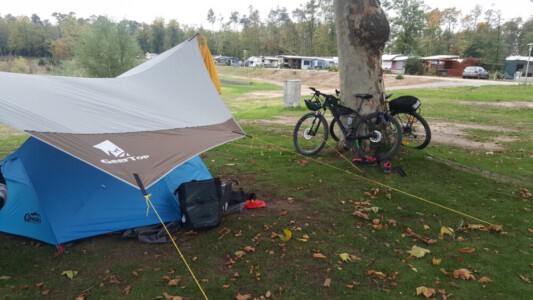 Our tent, tarp and the bikes at the Campsite Grosswelzheim.