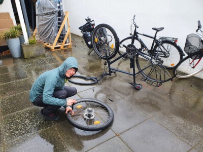 Fixing a flat tire in the cold rain of Höganäs.