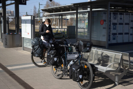 Arrival at the train station in Rostock, Alex preparing the navigation device.