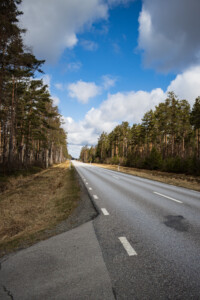 Länsväg 166 - a long mostly straight road with forest around.