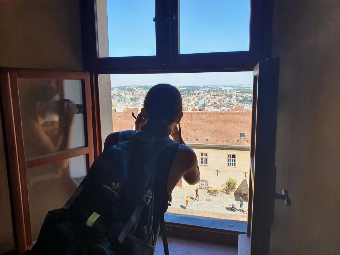 Alina taking photos from the lookout tower of the Spilberk castle over Brno.