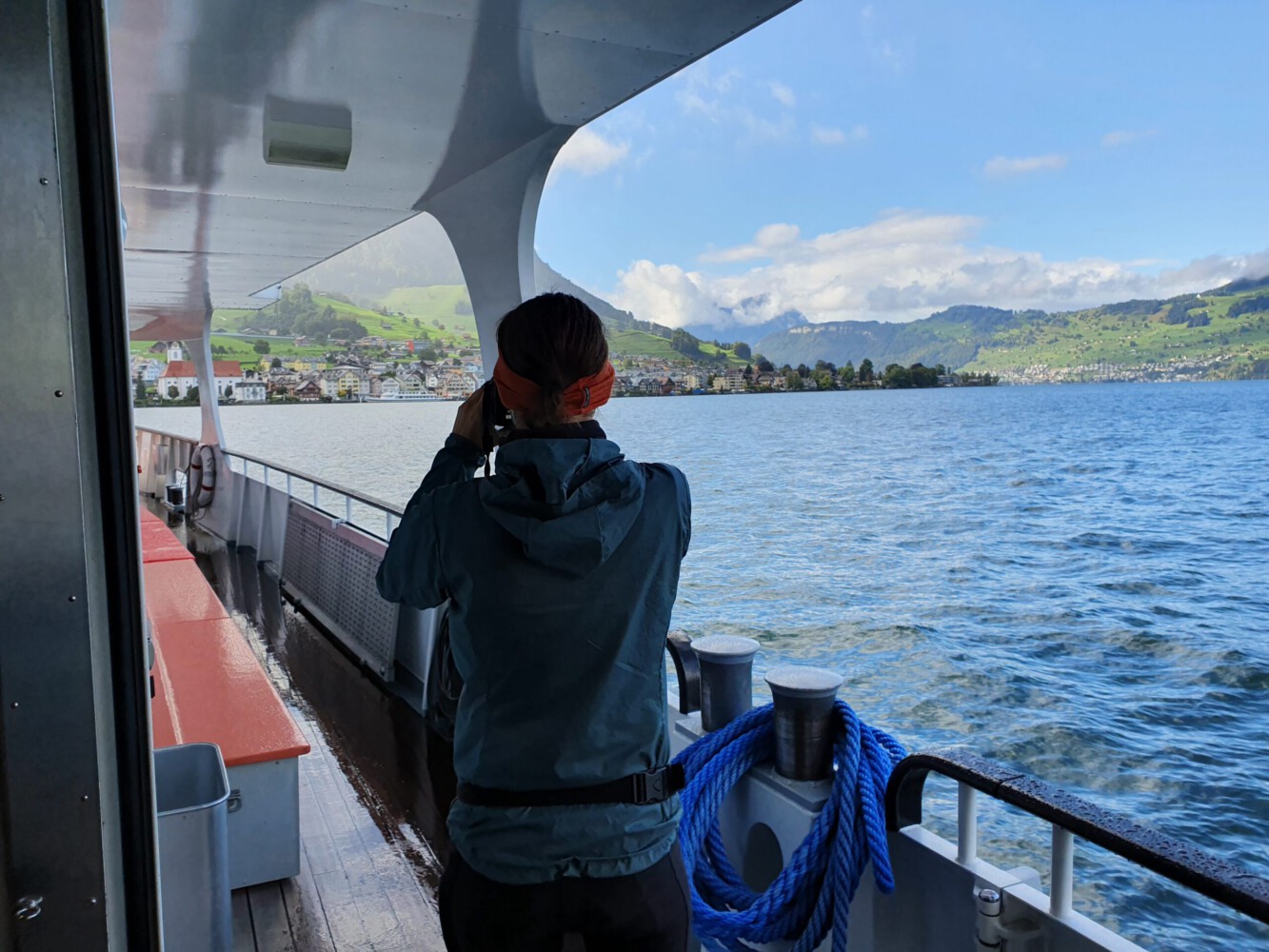 Alina taking photos on the boat while arriving in Beckenried.